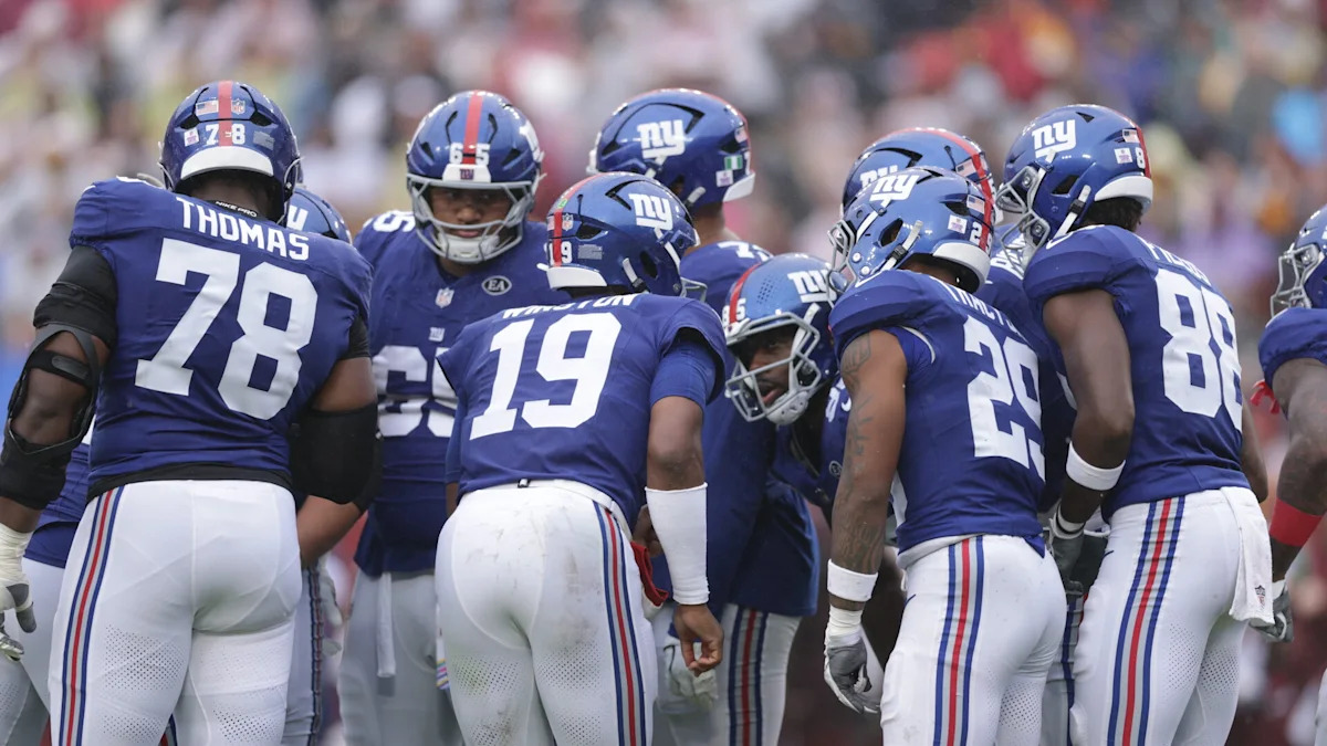 Jogadores dos Giants reunidos em campo.