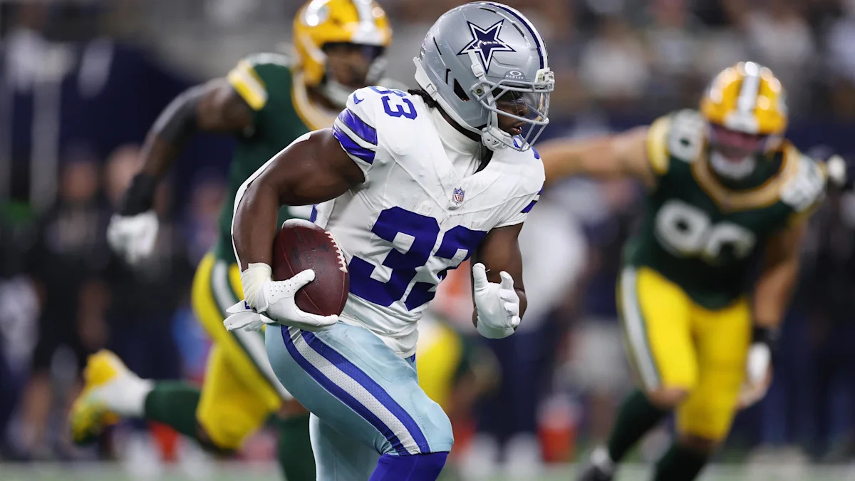 Javonte Williams corre pelos Cowboys contra os Packers.
