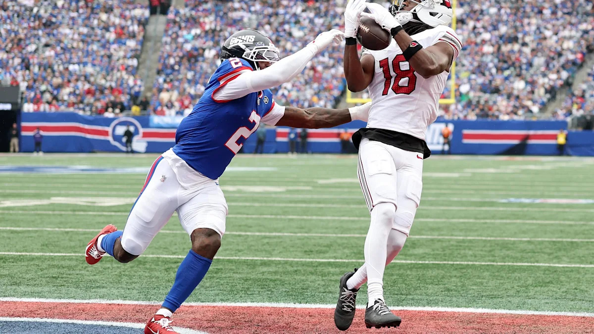 Marvin Harrison Jr. recebe um passe pelos Cardinals contra os Giants em 4 de outubro de 2026; imagem anterior à troca para Houston.