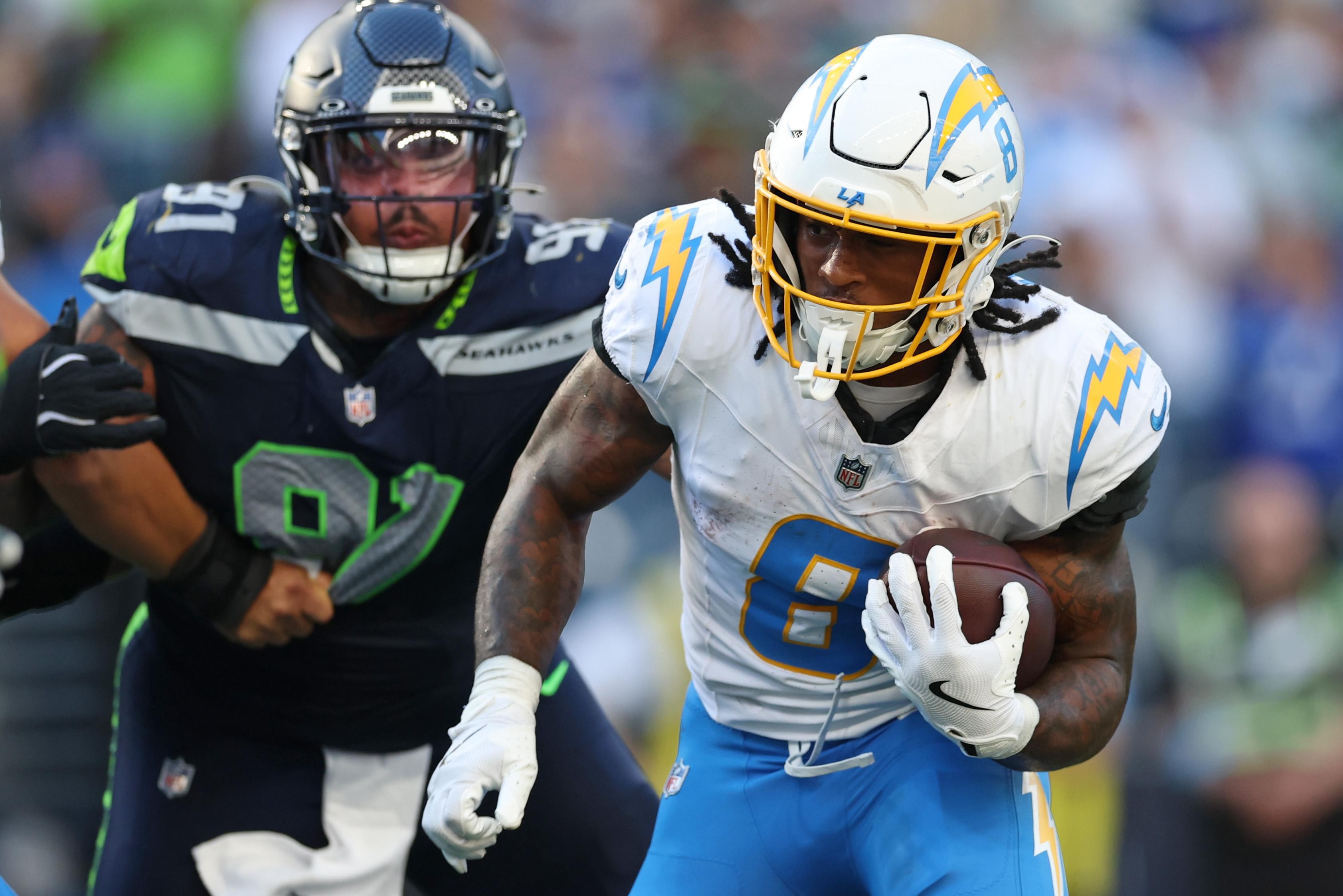 Omarion Hampton corre para touchdown contra os Seahawks em Seattle, em 4 de outubro de 2026.