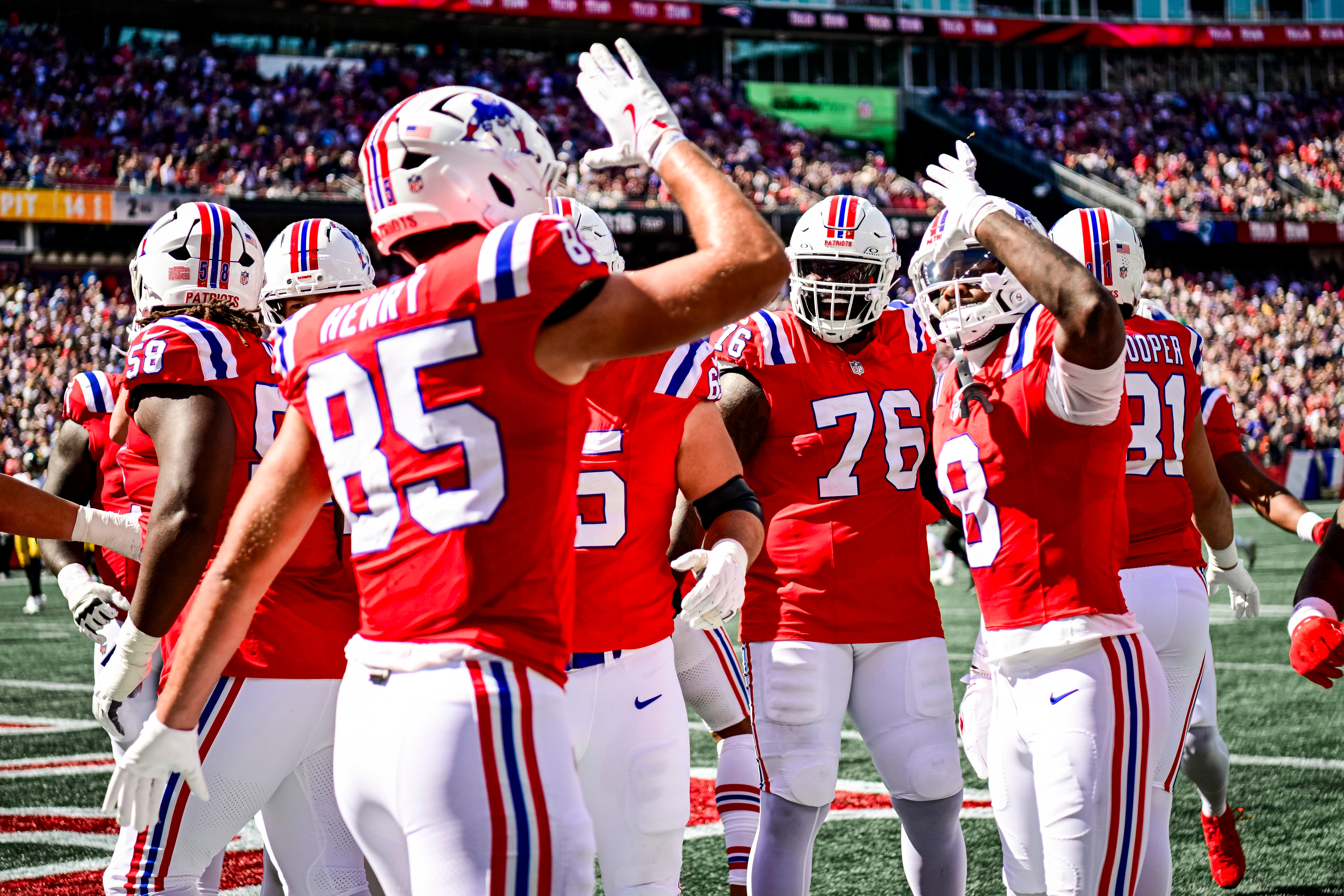Jogadores dos Patriots reunidos durante uma partida.