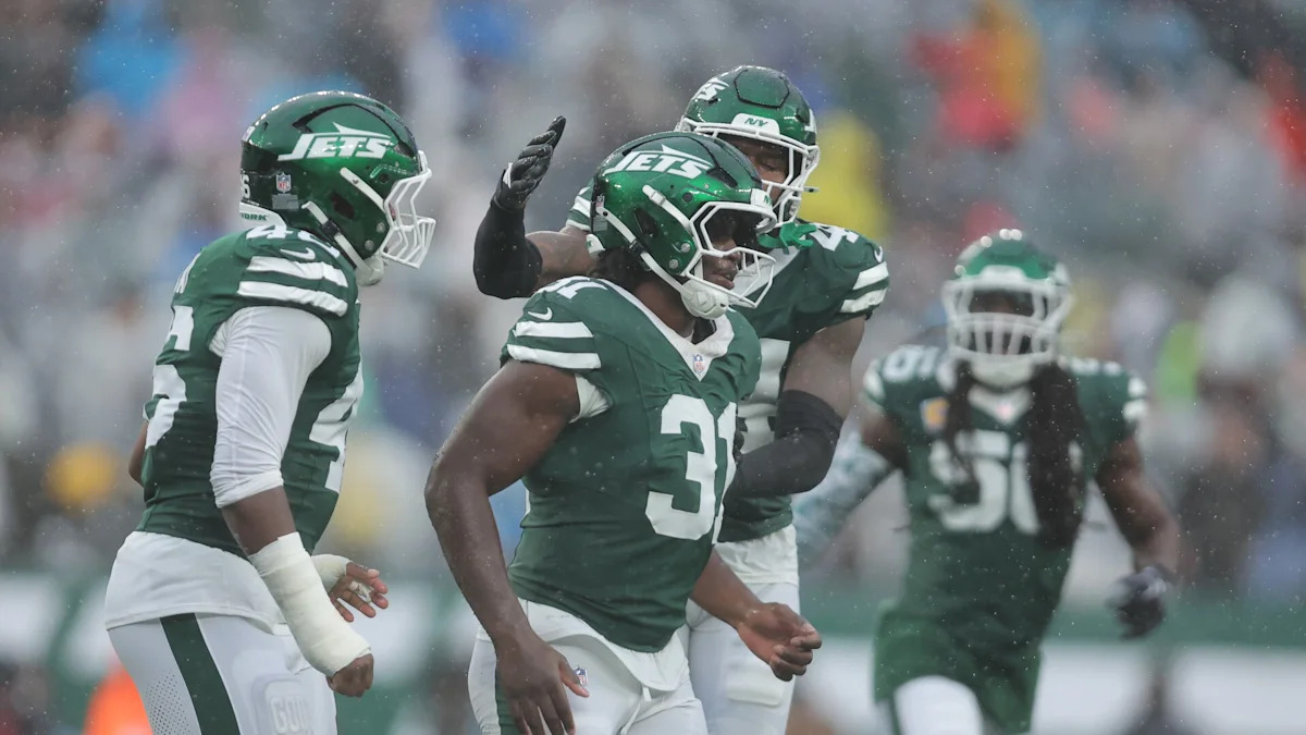 David Bailey e companheiros dos Jets em campo.
